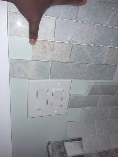 cutting tiles around light switches